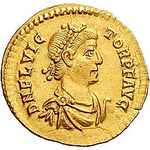 Golden coin depicting male wearing a diadem and facing right