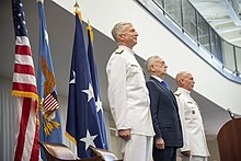 Admiral Craig S. Faller, commander, U.S. Southern Command, Secretary of Defense Jim Mattis, and Admiral Kurt W. Tidd, outgoing commander, share the stage during the SOUTHCOM change of command ceremony on 26 November 2018. Southern Command change of command 181126-D-PB383-053 (45155233205).jpg