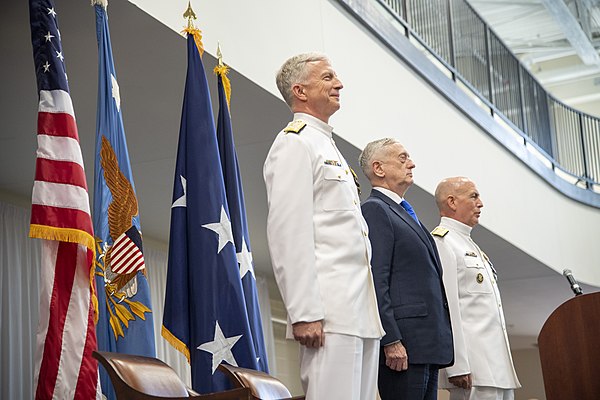 Admiral Craig S. Faller, commander, U.S. Southern Command, Secretary of Defense Jim Mattis, and Admiral Kurt W. Tidd, outgoing commander, share the st