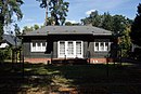 Single-family house including street-side fencing