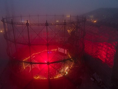 Suvilahti steel gasometer at night in heavy fog. Interior space was turned into a pop-up movie theatre Kino GAS during 10th—26th September 2021. Photographer: Ragnar Ljusström