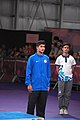 Deutsch: Tischtennis bei den Olympischen Jugend-Sommerspielen 2018: Tag 4, 10. Oktober 2018, Jungen-Einzel, Siegerehrung - Gold: Wang Chuqin (CHN), Silber: Tomokazu Harimoto (JPN), Bronze: Kanak Jha (USA); Medaillen überreicht durch IOC-Mitglied William Frederick Blick (UGA), Maskottchen überreicht durch ITTF-Präsident Thomas Weickert (GER) English: Fencing at the 2018 Summer Youth Olympics at 10 October 2018 –Boys' single medail ceremony – Gold: Wang Chuqin (CHN), Silber: Tomokazu Harimoto (JPN), Bronze: Kanak Jha (USA)); Medal presenter: IOC member William Frederick Blick (UGA), Mascot presenter: ITTF President Thomas Weickert (GER)