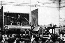 Wireless transmission of power and energy demonstration during his 1891 lecture, on very high frequency and potential TeslaWirelessPower1891 adjusted.png