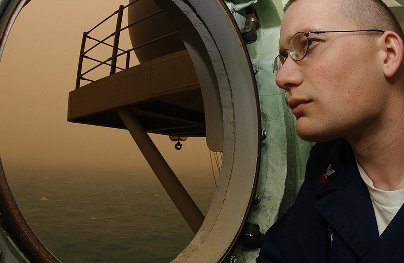 File:US Navy 030326-N-1352S-001 Aerographer's Mate 2nd Class Anthony Gruber, from Peoria, Ariz., observes a sand storm sweeping through the Arabian Gulf.jpg