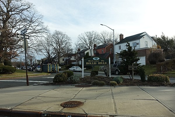 A welcome sign for Hollis Hills on Union Turnpike