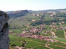 Southern view from the Rock of Vergisson. The more distant Rock of Solutré is seen on the sky-line a little left of center.