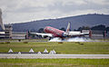 Virgin Blue (VH-ZPF) Embraer ERJ-190AR touches down at Canberra Airport.jpg
