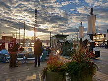 The fire pit at the Wharf Wharf fire pit at dusk.jpg