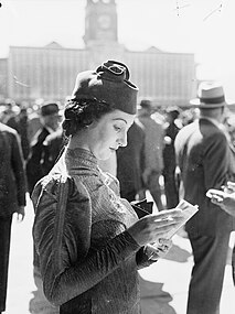 A woman attending a race at the Randwick Racecourse in Sydney, 1937.