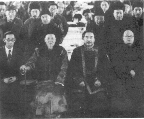 Burhan Shahidi (2nd row, 2nd from left) at the founding of the Association for the Advancement of Han Culture in Xinjiang in 1937, chaired by the governor Sheng Shicai (1st row, 3rd from left).