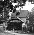 Reception building with adjoining goods handling building and toilet block