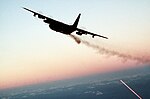 AC-130 gunship firing broadside at dusk.jpg