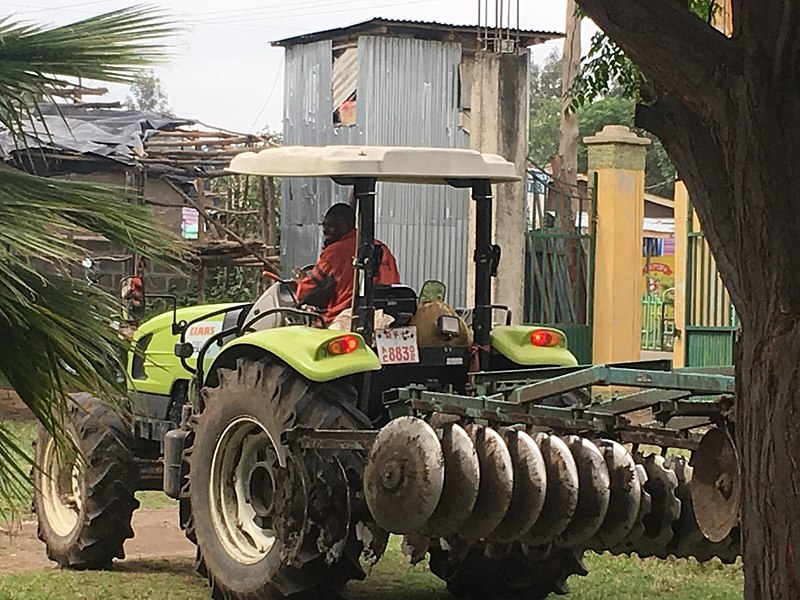 File:A farm tracker driver heading to plow farmer land.jpg