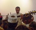 Bahauddin Dagar playing the Rudra veena in the South Indian posture