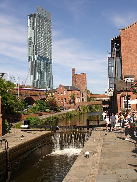 Castlefield retains much of its industrial character which is juxtaposed by modern buildings.