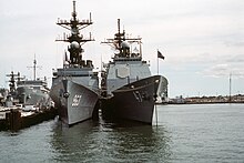 Ticonderoga-class cruiser's design was based on that of Spruance-class destroyer. Bow view of USS Spruance (DD-963) and USS Ticonderoga (CG-47) at Naval Station Norfolk on 8 October 1983 (6397938).jpg