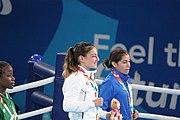 Deutsch: Boxen bei den Olympischen Jugendspielen 2018 Tag 12, 18. Oktober 2018 - Medaillenzeremonie im Fliegengewicht der Mädchen - Gold: Martina La Piana (Italien), Silber: Adijat Gbadamosi (Nigeria), Bronze: Heaven Destiny Garcia (USA); Medaillenübergabe durch Habu Gumel (IOC, Nigeria), Geschenkübergabe durch Dr. Joseph O. Ayeni (Nigeria, AIBA). English: Boxing at the 2018 Summer Youth Olympics on 18 October 2018 – Girl's flyweight Medal Ceremony - Gold: Martina La Piana (Italy), Silver: Adijat Gbadamosi (Nigeria), Bronze: Heaven Destiny Garcia (USA); Medal handover by Habu Gumel (IOC, Nigeria), Gift presented by Dr. Joseph O. Ayeni (Nigeria, AIBA). Español: Boxeo en los Juegos Olímpicos Juveniles de Verano de 2018 en 18 de octubre de 2018 - Ceremonia de la Medalla de peso mosca para niñas - Oro: Martina La Piana (Italia), Plata: Adijat Gbadamosi (Nigeria), Bronce: Heaven Destiny Garcia (Estados Unidos); Entrega de medallas por Habu Gumel (COI, Nigeria), Regalo presentado por Joseph O. Ayeni (Nigeria, AIBA).