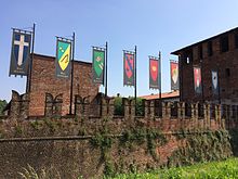 A glimpse of Visconteo Castle of Legnano, with the banners of the eight contrade Castello di San Giorgio a Legnano14.jpg