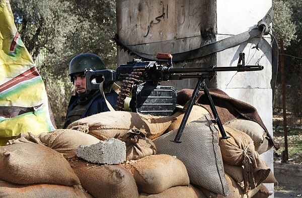 A Syrian soldier manning a checkpoint near Damascus.