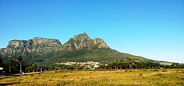 Devils Peak with University of Cape Town seen across Rondebosch Common.jpg