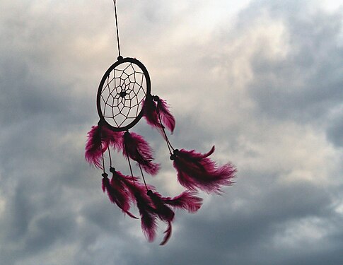 dreamcatcher in front of cloudy sky