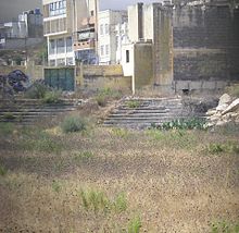 The former playing area is now covered with weeds