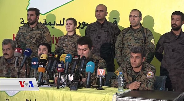 Press conference of the SDF on 22 January 2018, involving Kino Gabriel (center), spokesman of the SDF.