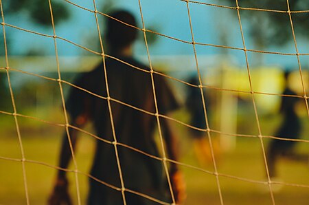 ไฟล์:Goalkeeper through the soccer goal net (Unsplash).jpg