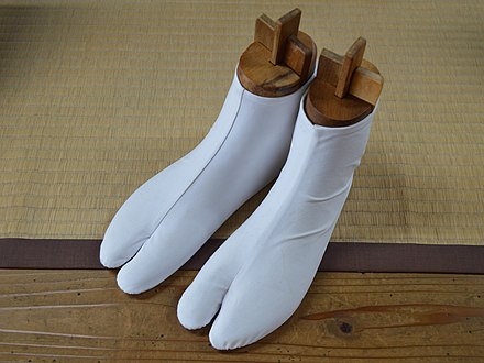 Japanese tabi socks, traditionally white or black, to be worn with zōri sandals