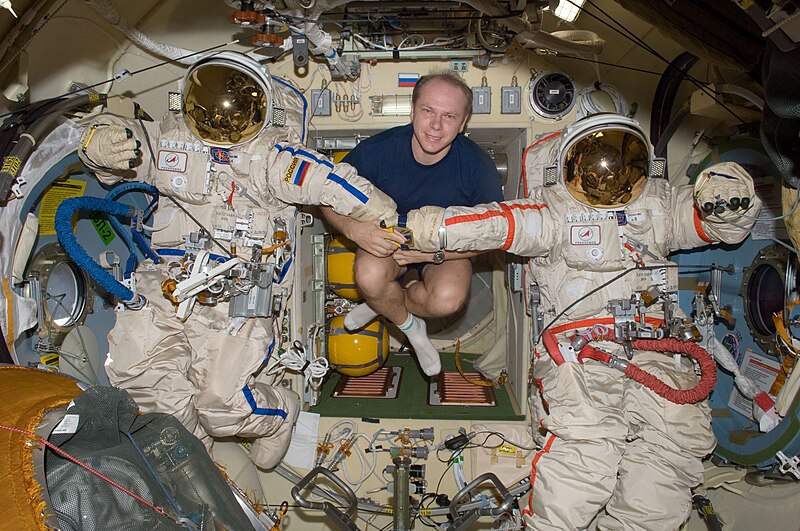 File:ISS-22 Oleg Kotov in the Poisk Docking Compartment of the ISS.jpg