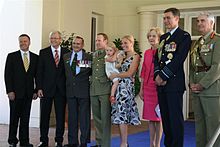 Donaldson with family (centre) and other dignitaries after the investiture ceremony. Investiture of the Victoria Cross for Australia to Trooper Mark Donaldson 2.jpg