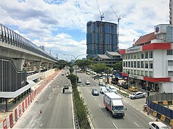 Jalan Kepong, looking east-ward towards Bulatan Kepong with the elevated tracks of the MRT Putrajaya Line on the left. Jalan Kepong 2.jpg