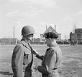 Commander of the 82nd (US) Airborne Division receiving the DSO from Field Marshal Sir Bernard Montgomery in Munchen Gladbach