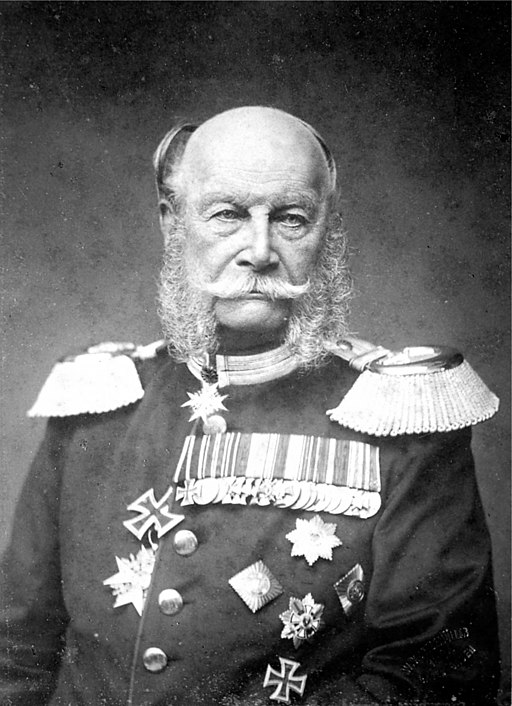 Photograph of an elderly Wilhelm, the bald man with side whiskers