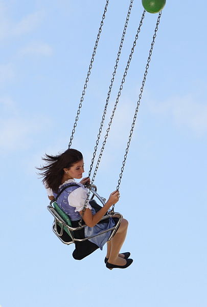 A woman on a swing ride at the Oktoberfest in Munich, Germany