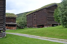 17th-century log buildings in Heidal, Norway; the corner house is a horse stable and log barn Kruke 2015.jpg