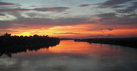 Sunset over Hong River, view from Long Bien Bridge, Hanoi, Vietnam