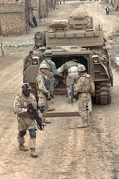 Infantry of the 3rd Armored Cavalry Regiment of the United States Army boarding an M2 Bradley IFV in Iraq in 2006