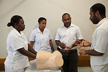 Midwives training at Pacific Adventist University. Midwives training at Pacific Adventist University PAU, outskirts of Port Moresby, PNG. (10702413575).jpg