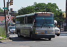 New York City Transit bus at 177th Street near Devoe Ave, Bronx, NY. Route sign reads, "Masks Required" NYC Bus with "masks required" sign.jpg