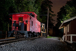 Erie C254 and 1654 pose at night next to the Rochester, Lockport & Buffalo Waiting room. RGVRRM EireAtNight.jpg