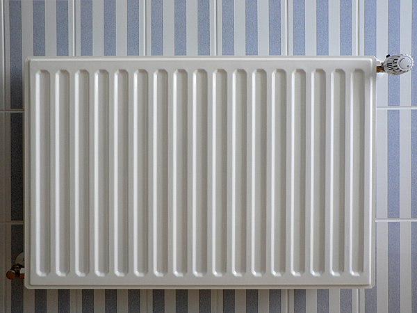 A panel convector radiator, typical of a standard central heating system in the UK