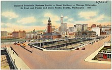 Postcard depiction of King Street Station and Union Station in the late 1930s, including the future site of International District/Chinatown station Railroad terminals Northern Pacific -- Great Northern -- Chicago Milwaukee, St. Paul, and Pacific and Union Pacific, Seattle, Washington (69005).jpg