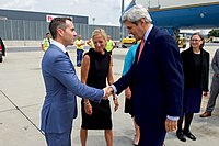 Secretary Kerry Shakes Hands With U.S. Ambassador for Security and Co-operation Baer After Arriving at the Vienna International Airport (28364677682).jpg