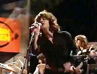 Singer Mike Harrison on stage with the band in the 1970s Spooky tooth 2.JPG