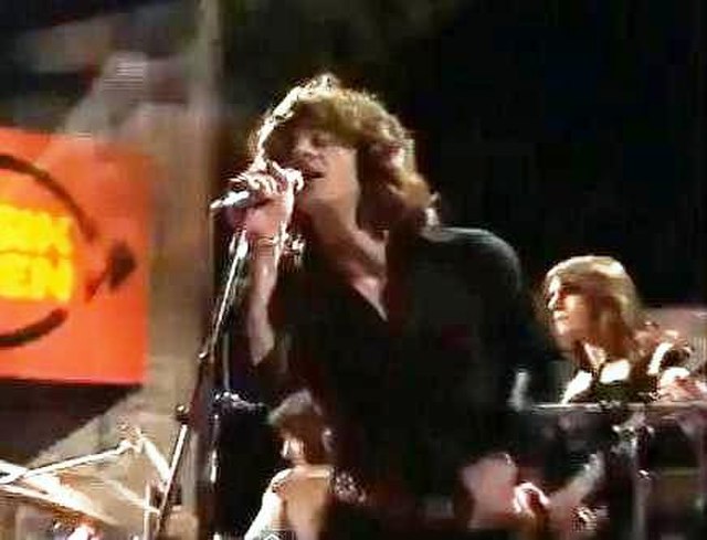 Singer Mike Harrison on stage with the band in the 1970s