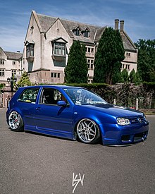 A Mark 4 R32 Golf displaying the "stanced" look with aftermarket air suspension and Blitz03 & Work VSKF Wheels with negative camber. Stanced MK4 R32 Golf.jpg