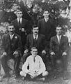 StateLibQld 1 292179 Crew of fourteen footer Sharpie known as Nell, ca. 1915.jpg