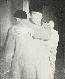 President Sukarno hugging his general, Sudirman, upon meeting in the palace after the latter's guerrilla campaign. Interestingly, the general is not hugging him back. This photograph appears to be the first one taken of the meeting by Frans Mendur; the second is a bit more famous.