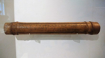 A musical instrument (tube zither) with Tagbanwa calligraphy